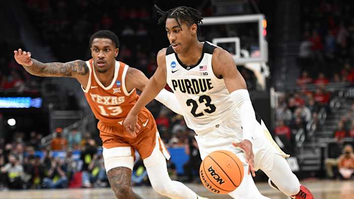 Purdue Boilermakers guard Jaden Ivey (23) drives to the basket during the second half against Texas Longhorns guard Jase Febres.
